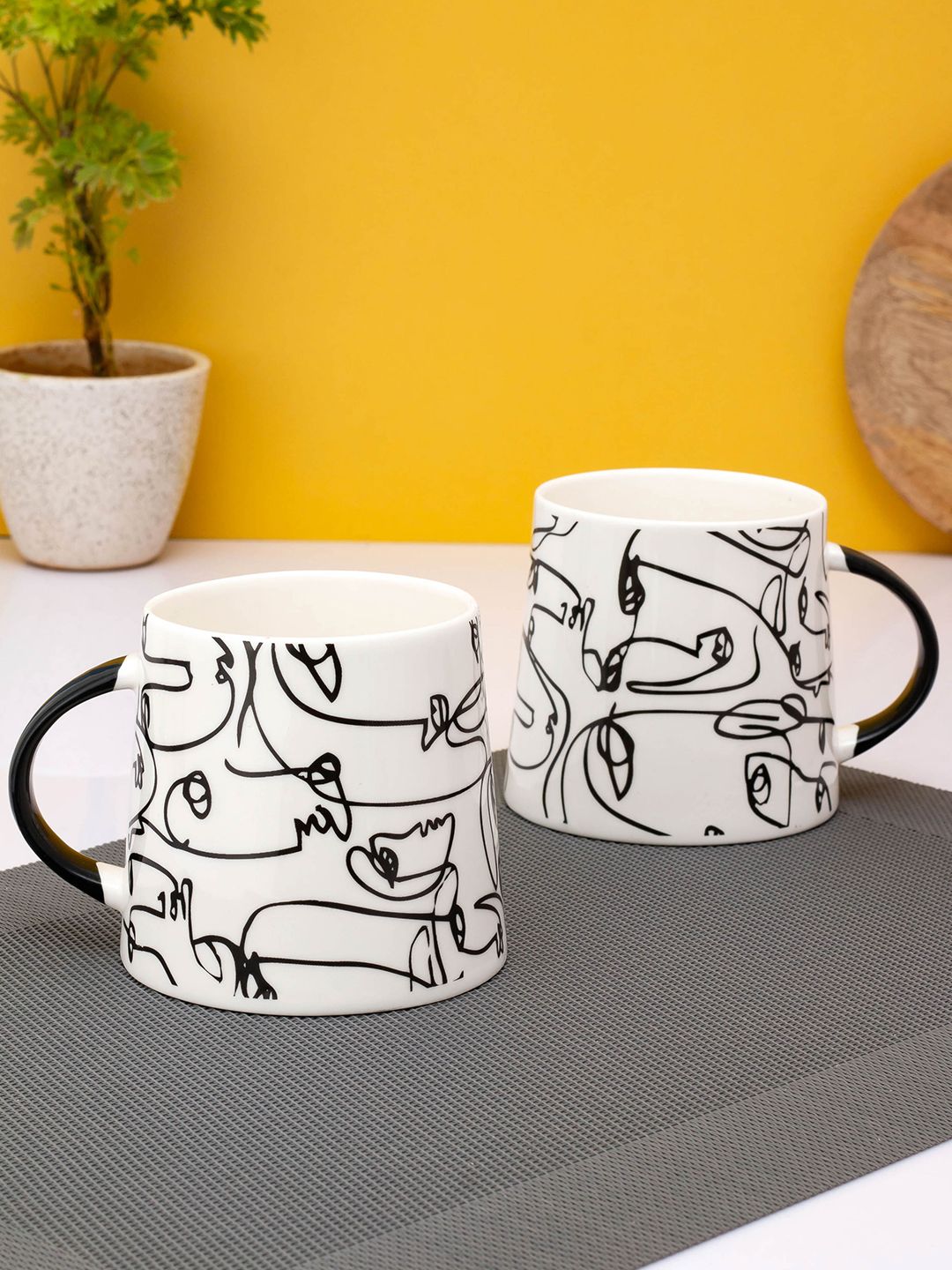 JCPL White & Black Printed Ceramic Glossy Mugs Set of Cups and Mugs Price in India