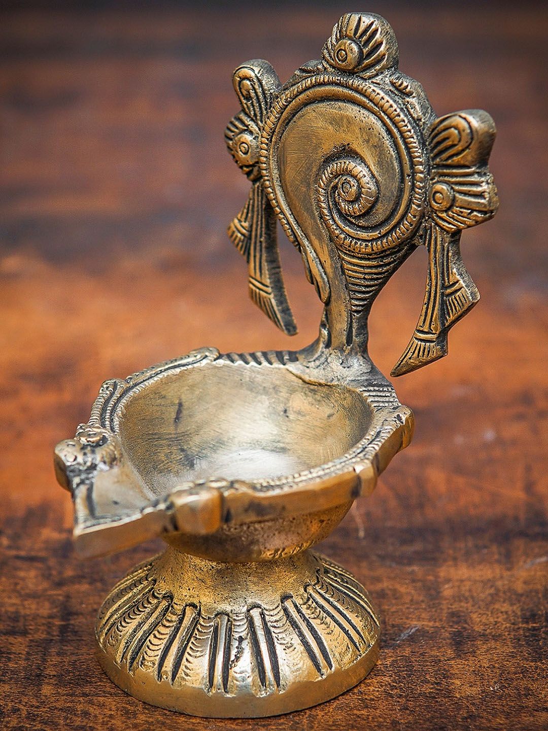 StatueStudio Gold-toned Textured Shankh Diya Price in India