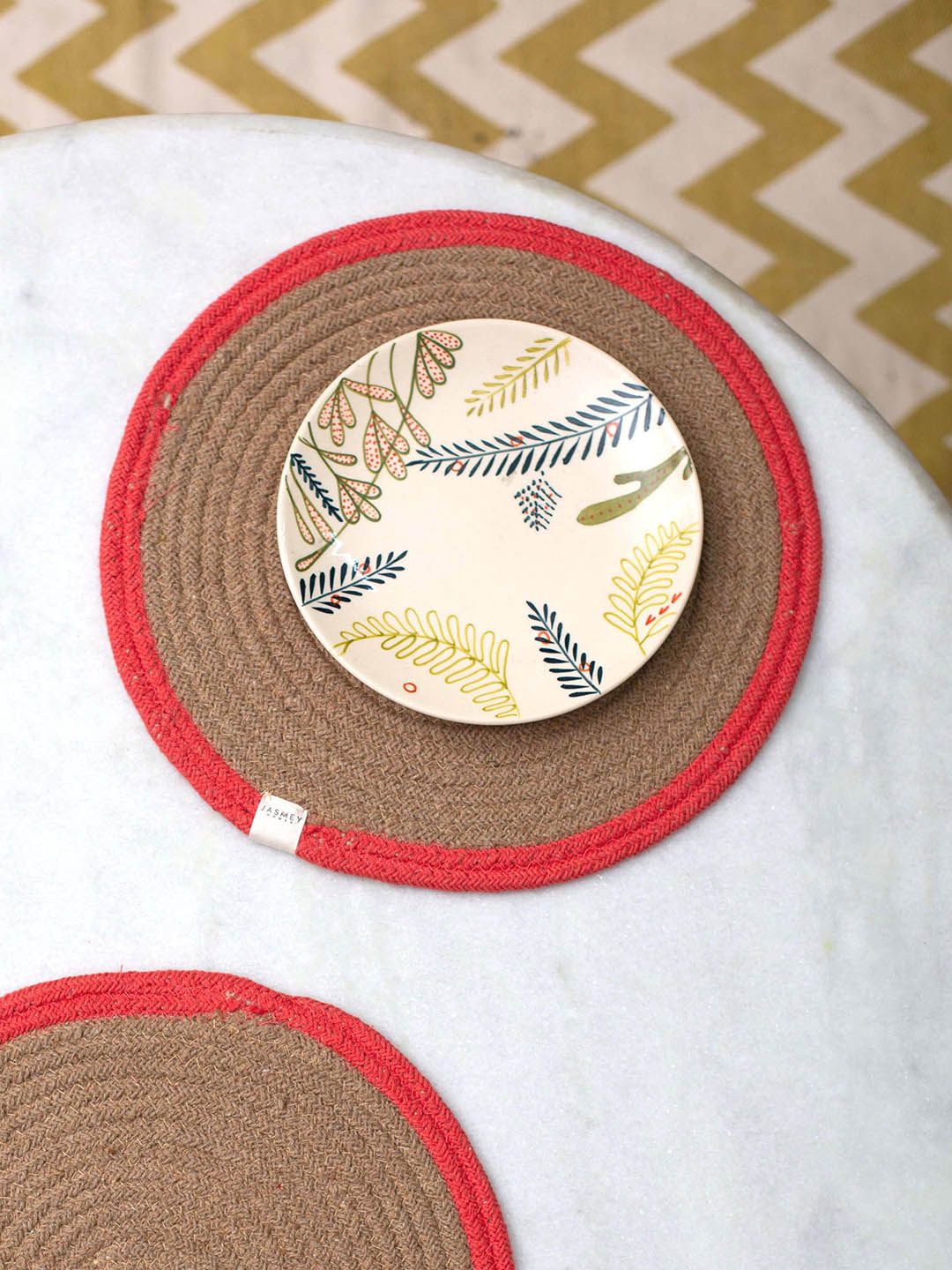 JASMEY HOMES Set Of 4 Brown & Coral Solid Round Table Placemats Price in India