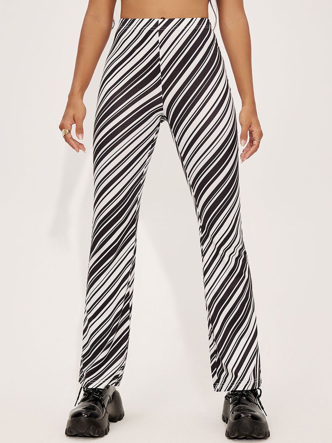 URBANIC Women Black Striped Trousers Price in India