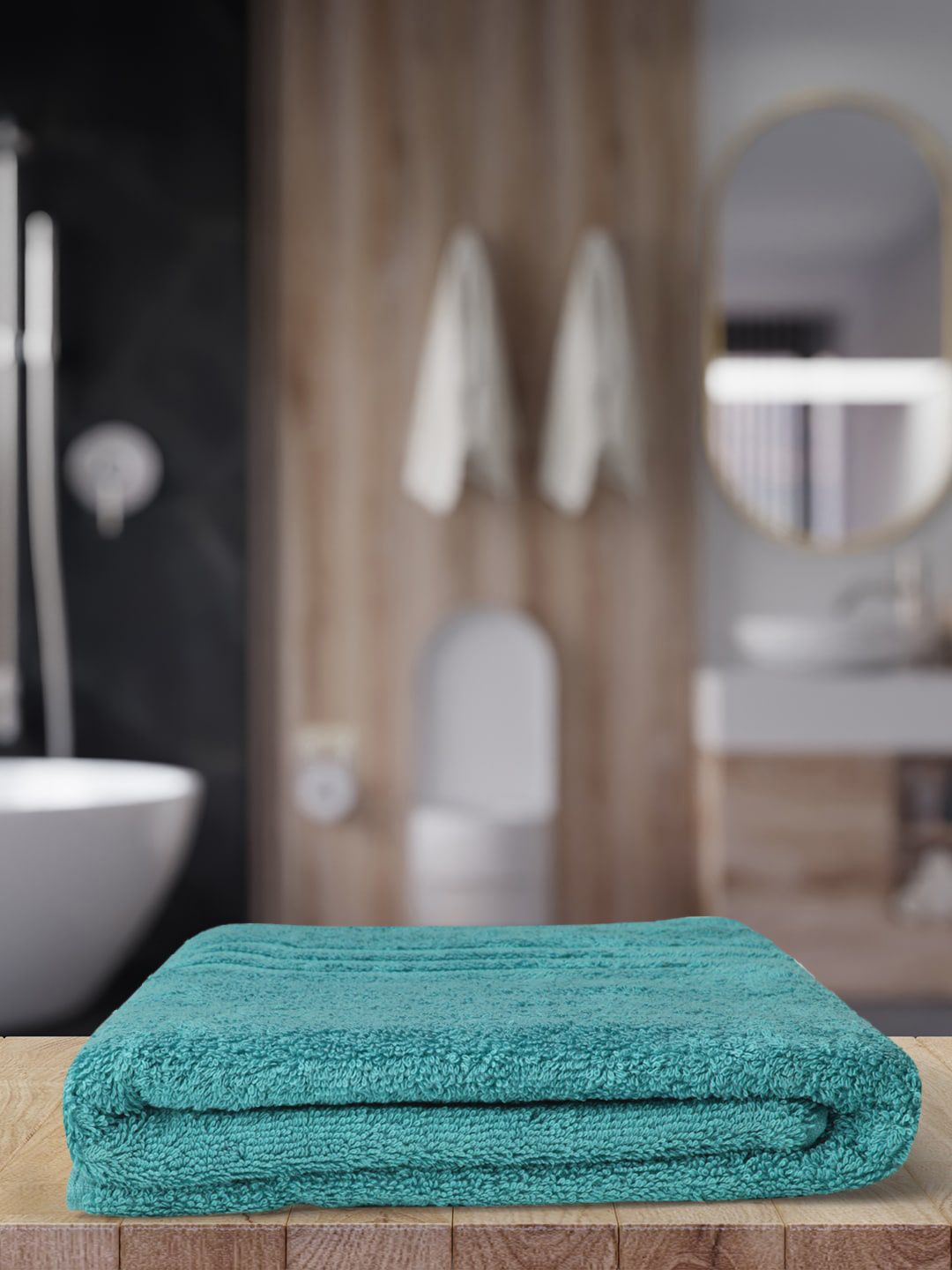 Monte Carlo Teal Blue Solid 525 GSM Cotton Bath Towels Price in India