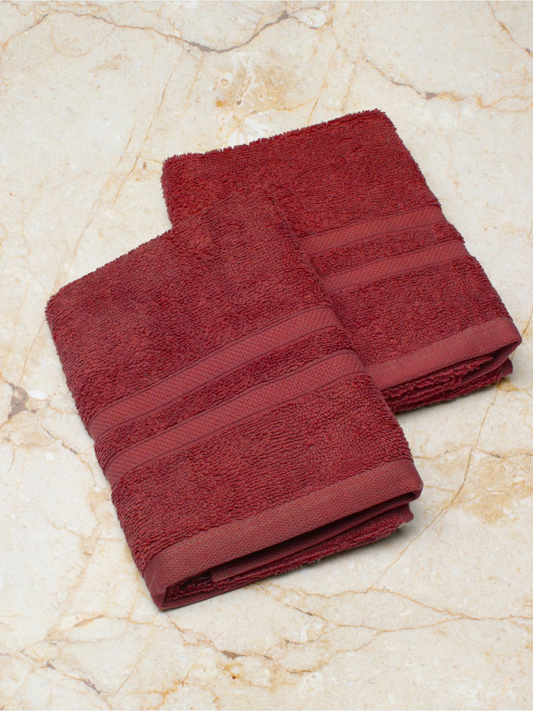 Monte Carlo Set Of 2 Maroon Solid 525 GSM Cotton Hand Towels Price in India