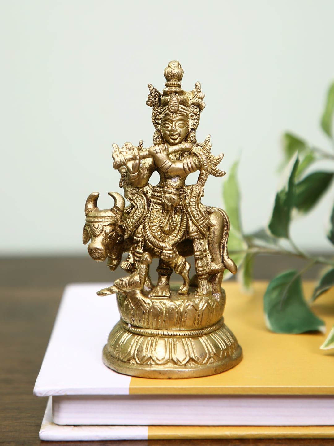 HomeTown Gold Toned Brass Krishna With Cow Figurine Showpieces Price in India