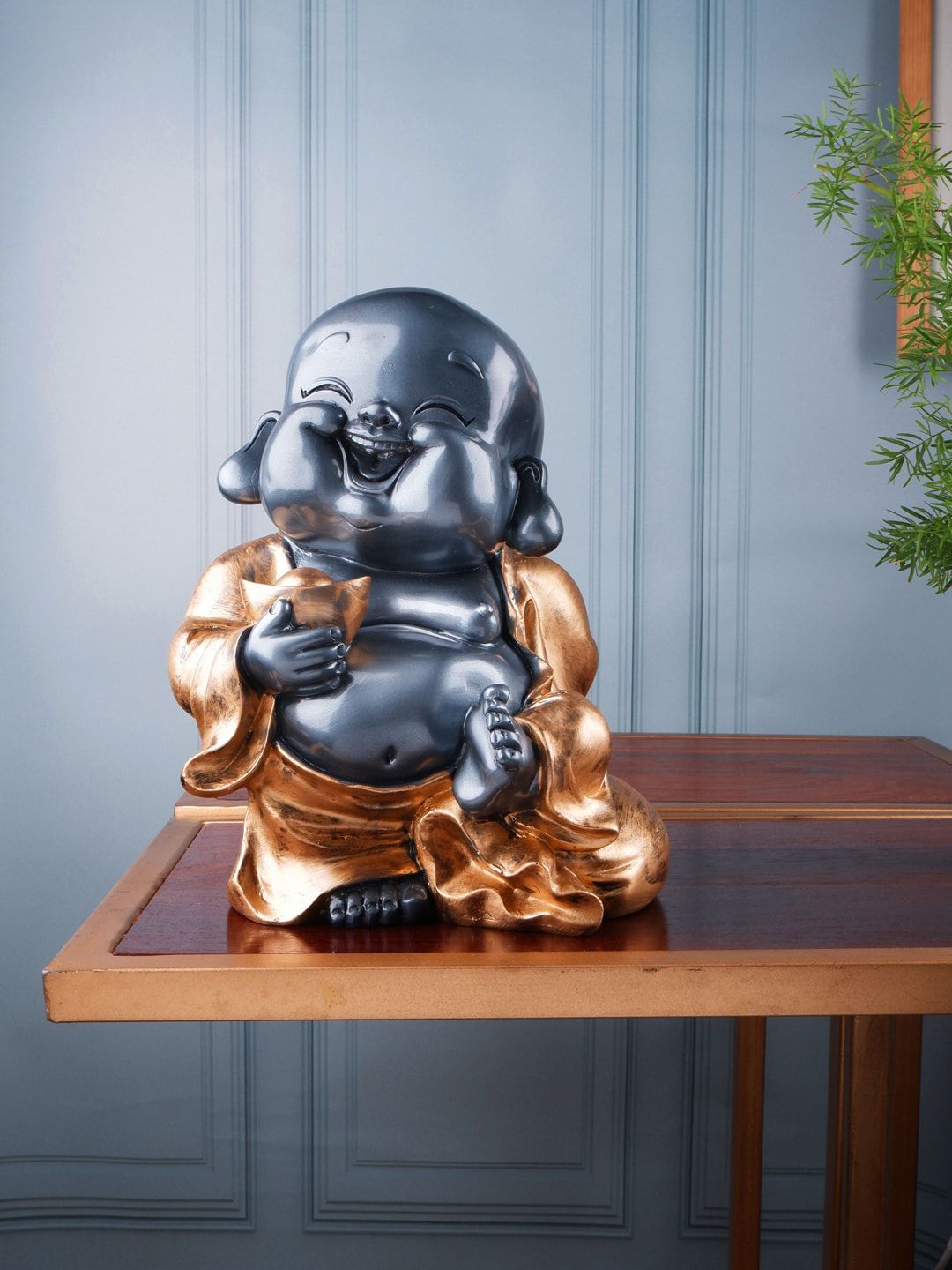 THE WHITE INK DECOR Gold-Toned & Grey Fengsui Monk Showpiece Price in India
