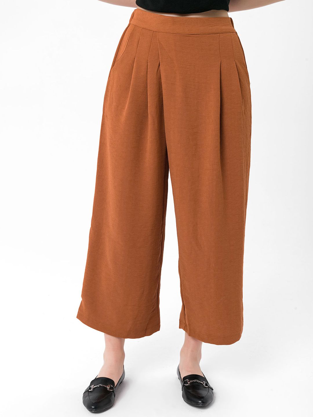 bebe PLUS Women Rust Orange Solid Loose Fit Trousers Price in India