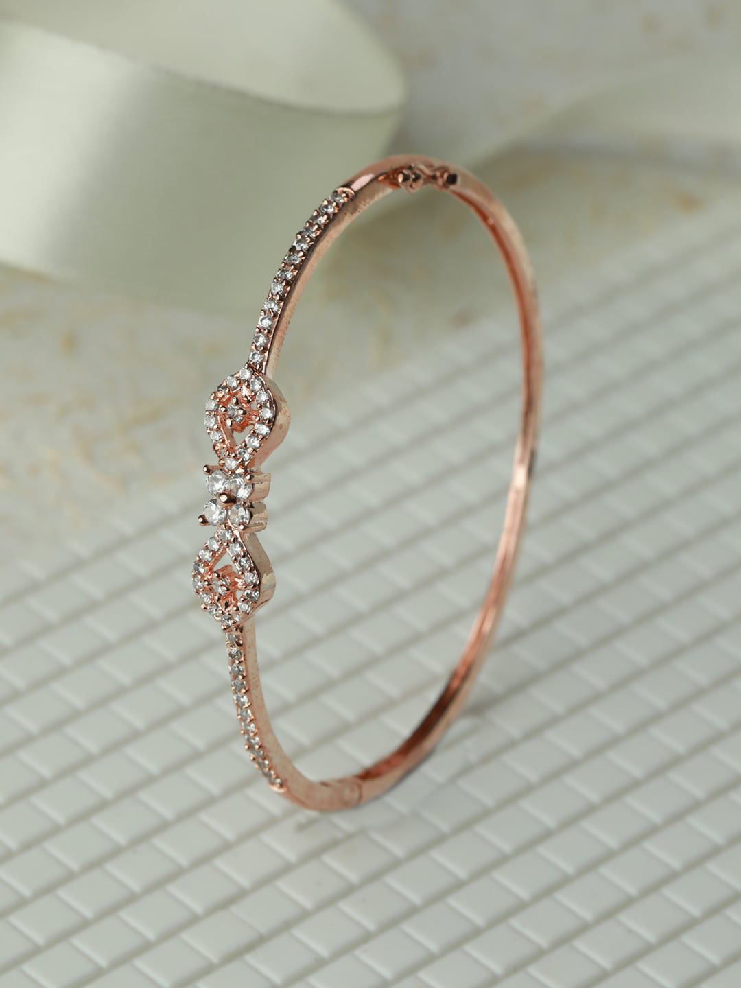 Priyaasi Women Rose Gold-Plated Brass American Diamond Studded Bangle-Style Bracelet Price in India