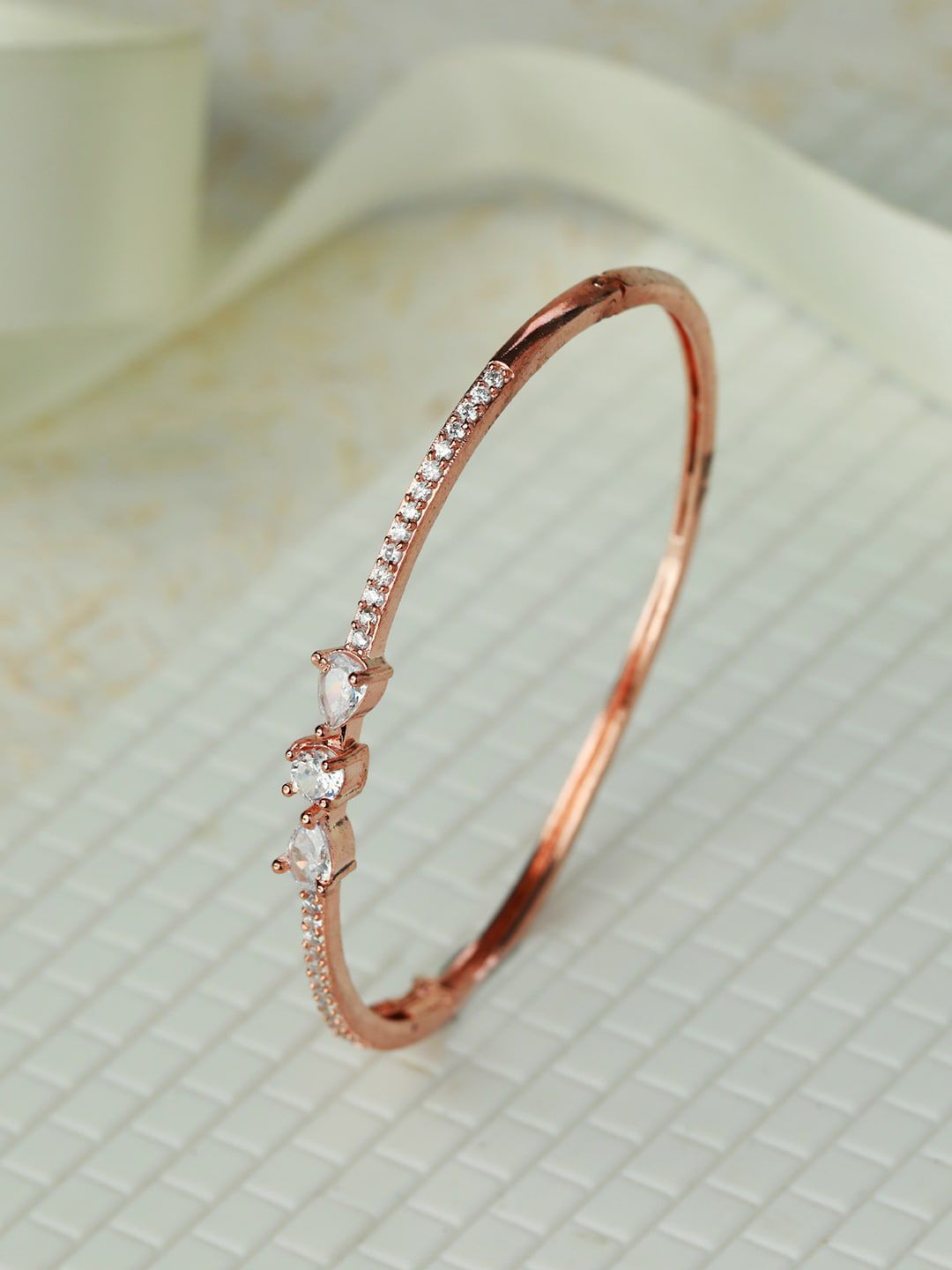 Priyaasi Women Silver-Toned Brass American Diamond Rose Gold-Plated Bangle-Style Bracelet Price in India