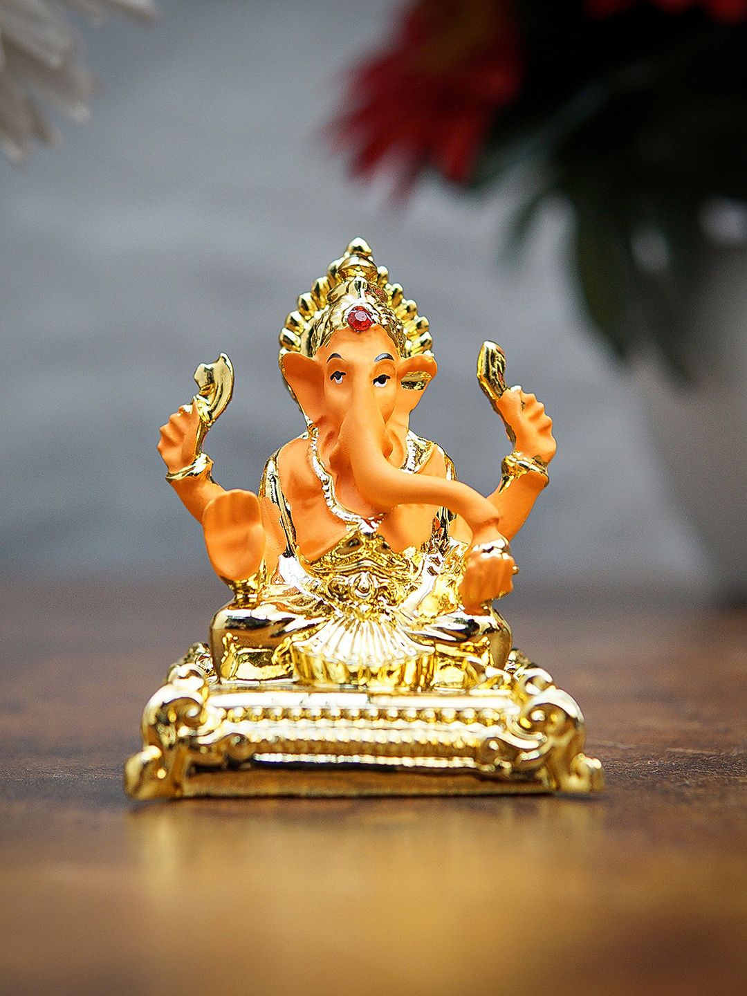 StatueStudio Gold-Toned & Orange Polyresin Ganesha Idol Showpieces Price in India