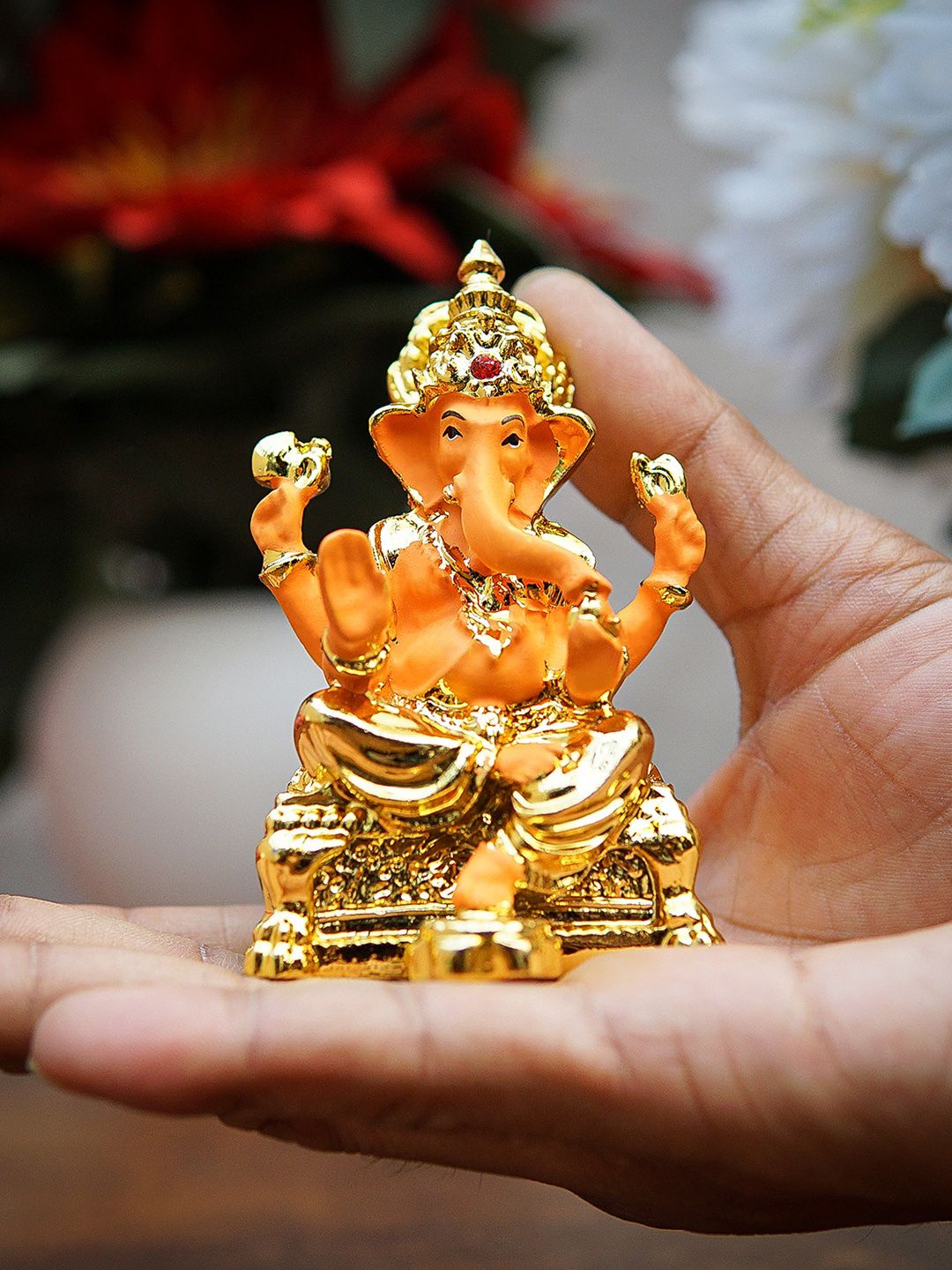 StatueStudio Gold-Toned & Orange Textured Lord Ganesh Showpieces Price in India