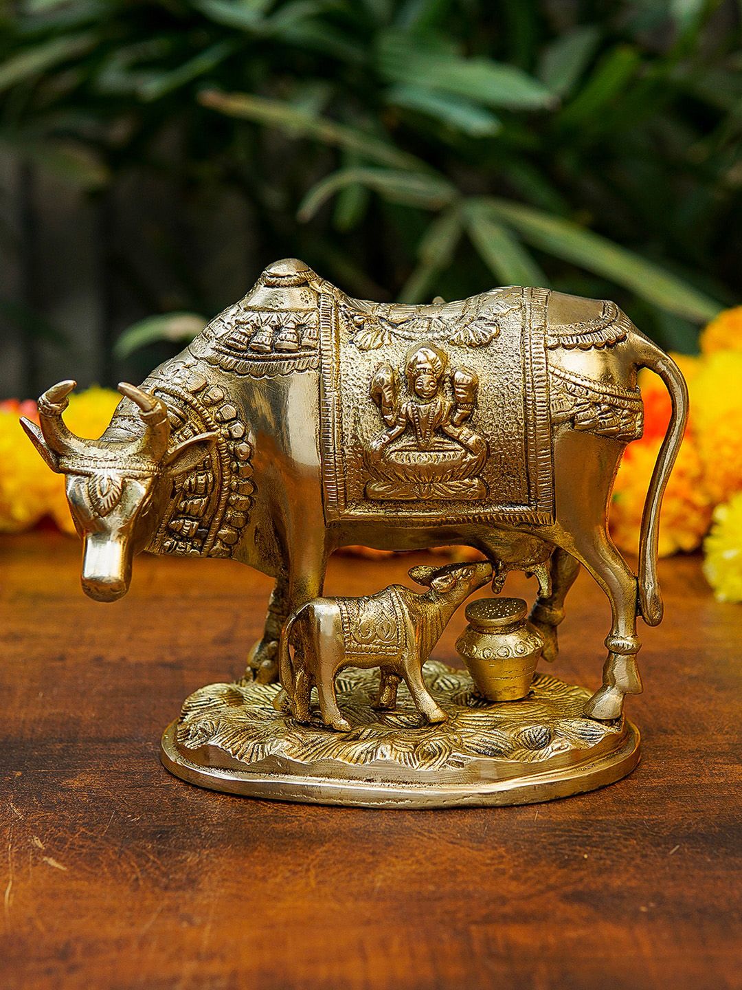 StatueStudio Gold Toned Cow and Calf Statue With Engraved Laxmi Idol Showpiece Price in India