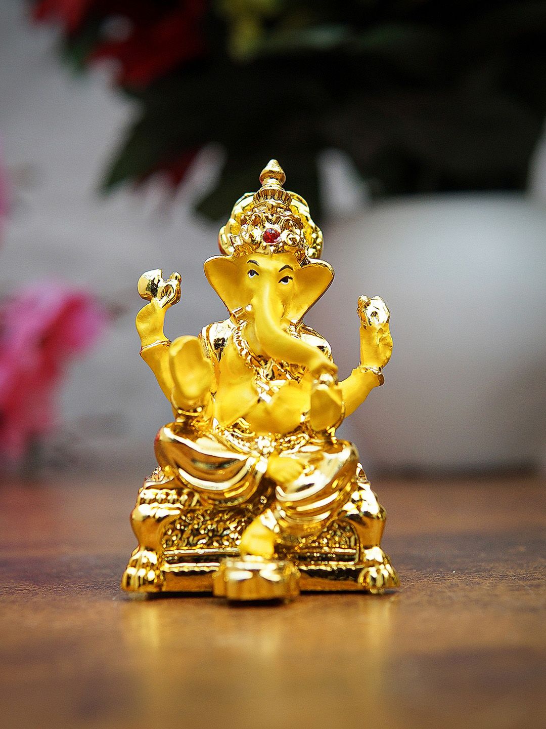 StatueStudio Gold-Toned & Yellow Ganesha Idol Showpieces Price in India