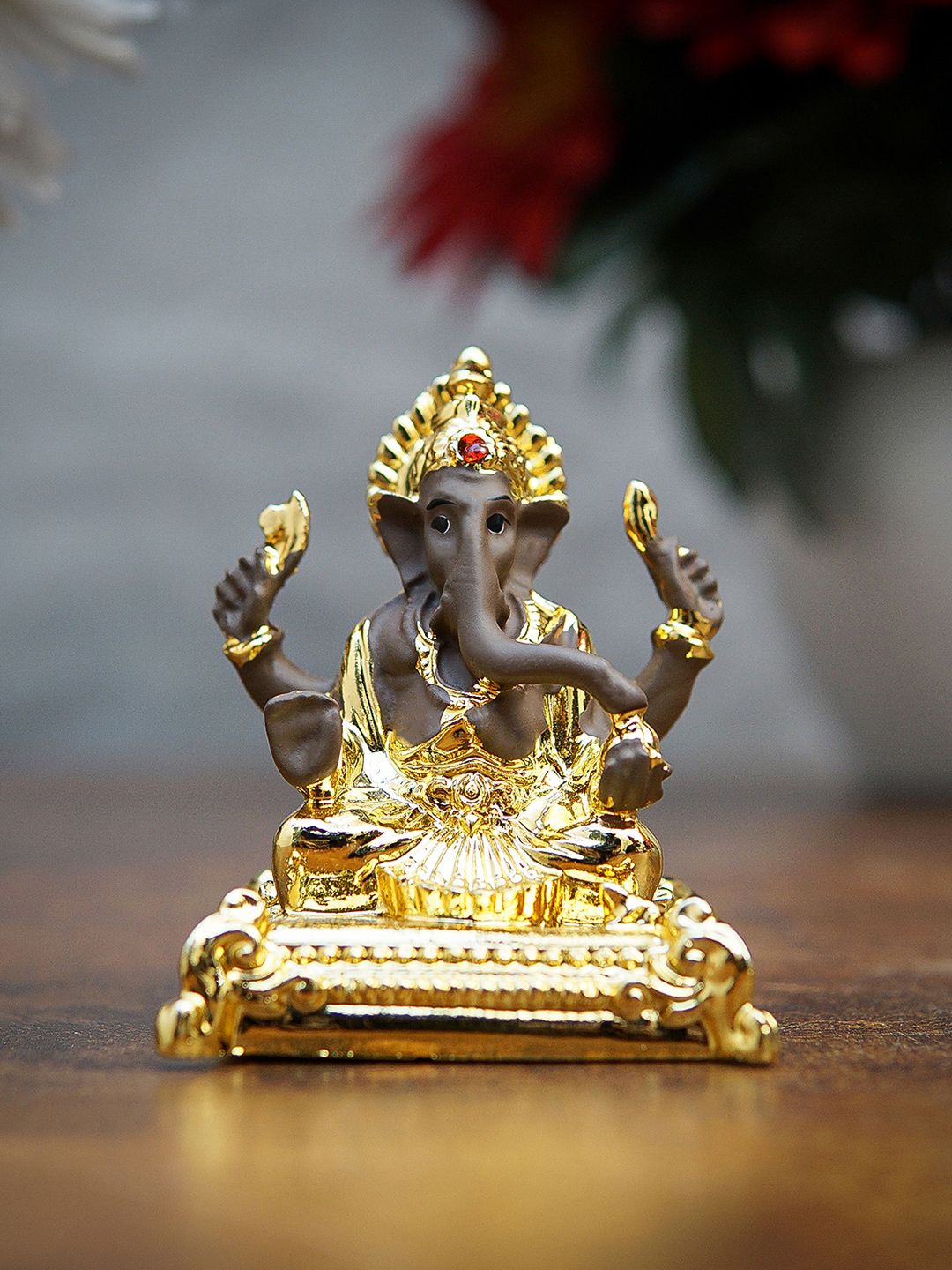 StatueStudio Gold-Toned Ganesha Idol Polyresin Showpiece Price in India