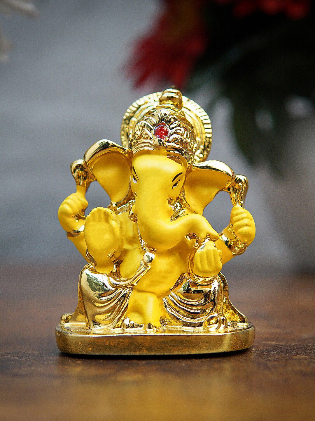 StatueStudio Gold-Toned & Yellow Ganesha Idol Showpiece Price in India
