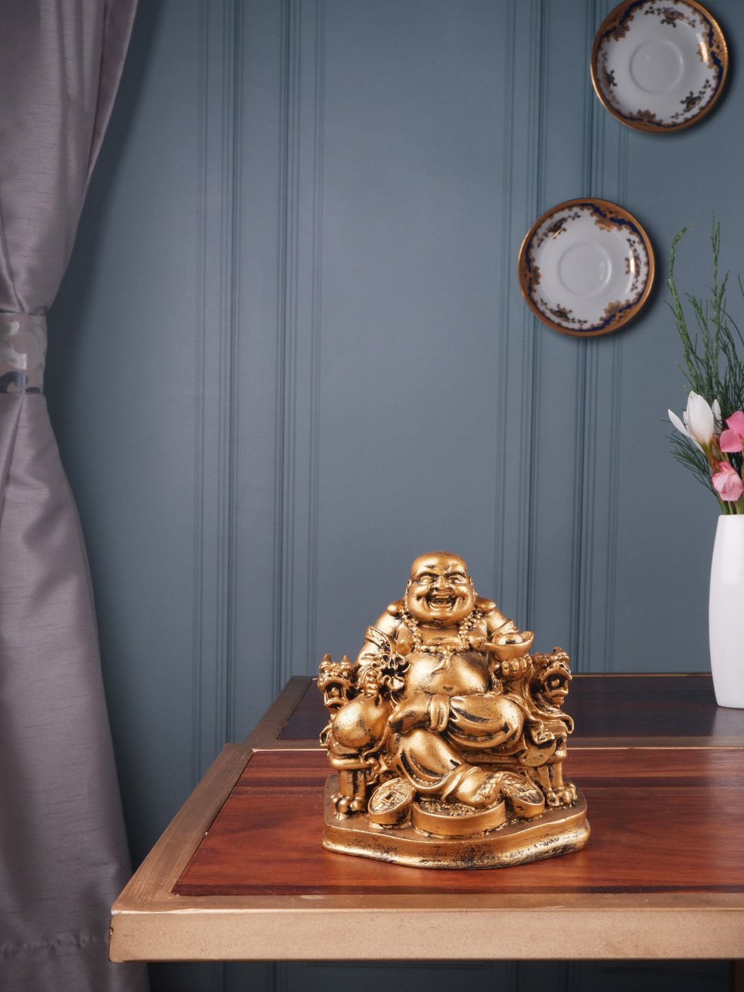 THE WHITE INK DECOR Gold-Colored Laughing Buddha Sitting on Dragon Chair Fengshui Showpieces Price in India