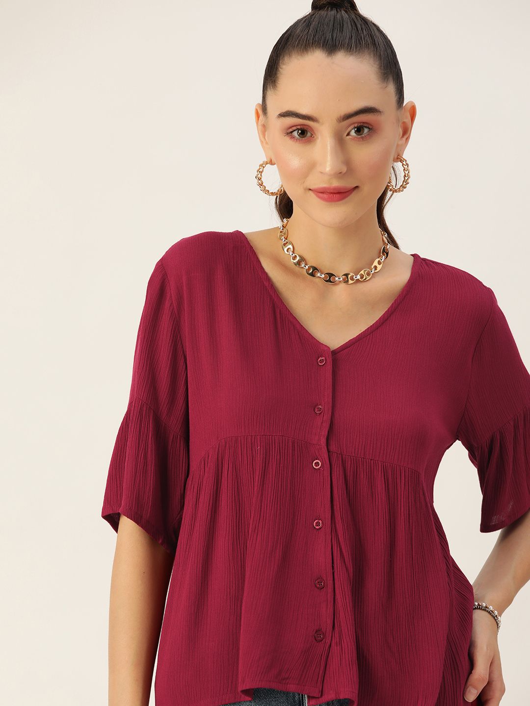 DressBerry Maroon Solid V-Neck Peplum Top Price in India