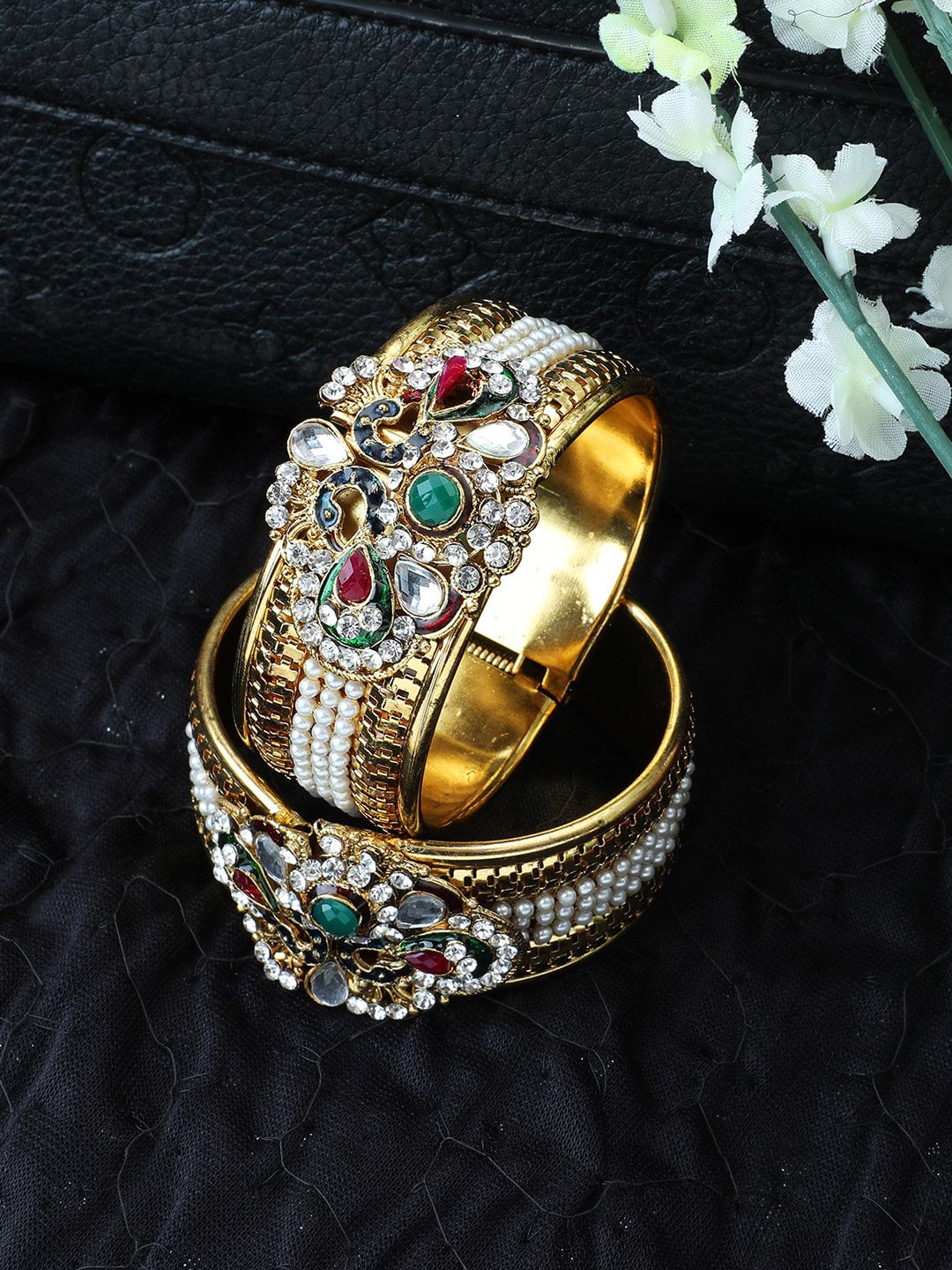 ANIKAS CREATION Women Gold Plated Traditional peacock Pearl And Stone Studded Bracelet Price in India