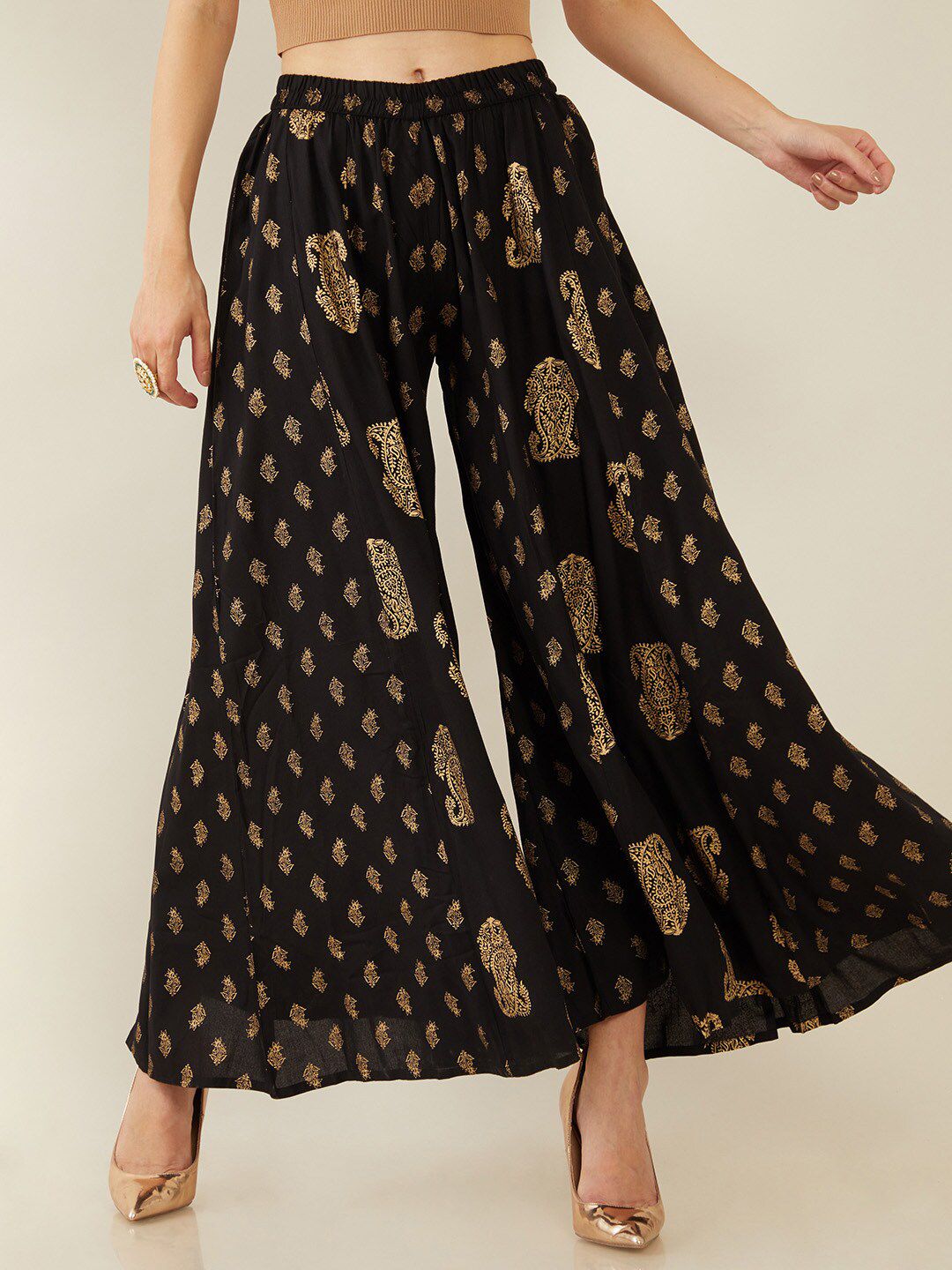 Soch Women Black & Gold-Toned Paisley Printed Flared Knitted Ethnic Palazzos Price in India