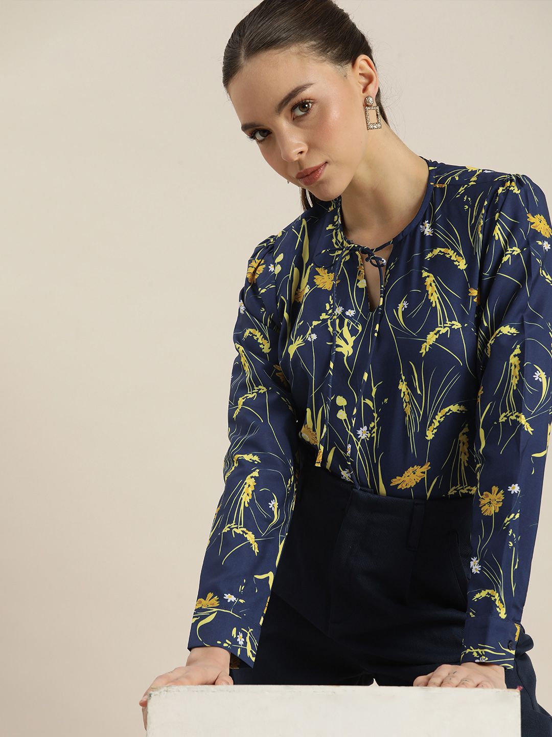 encore by INVICTUS Blue & Yellow Floral Print Tie-Up Neck Top Price in India