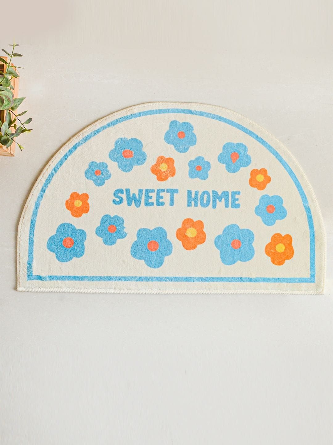 Nestasia Off-White & Blue Floral Semicircle Doormat Price in India