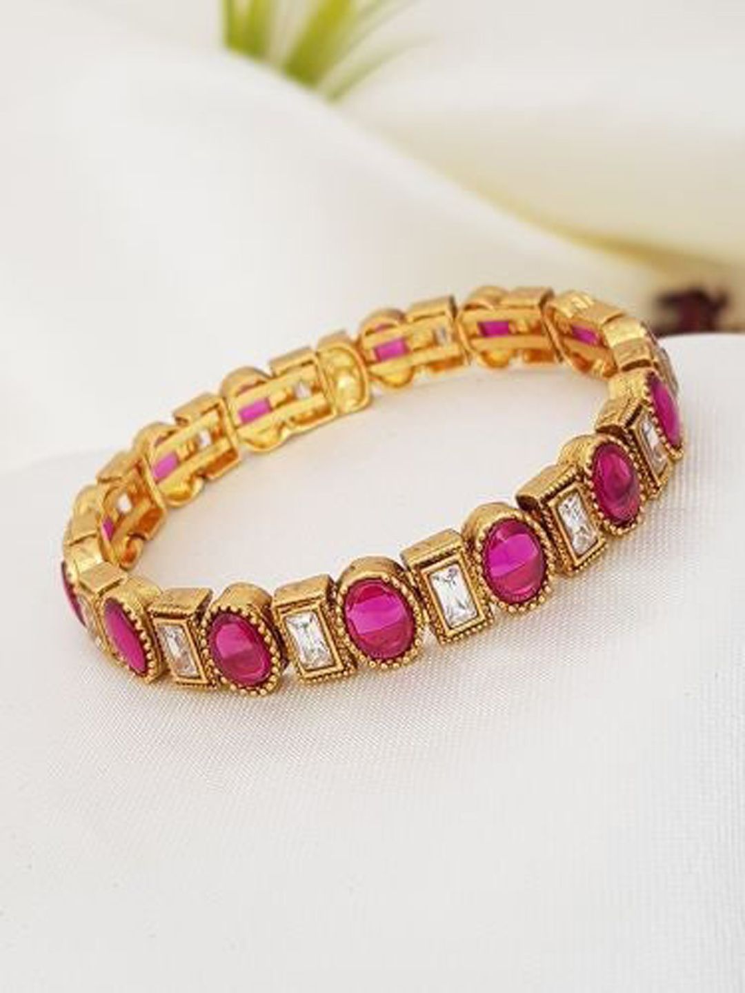 GRIIHAM Women Gold-Toned & Pink Brass Gold-Plated Kada Bracelet Price in India
