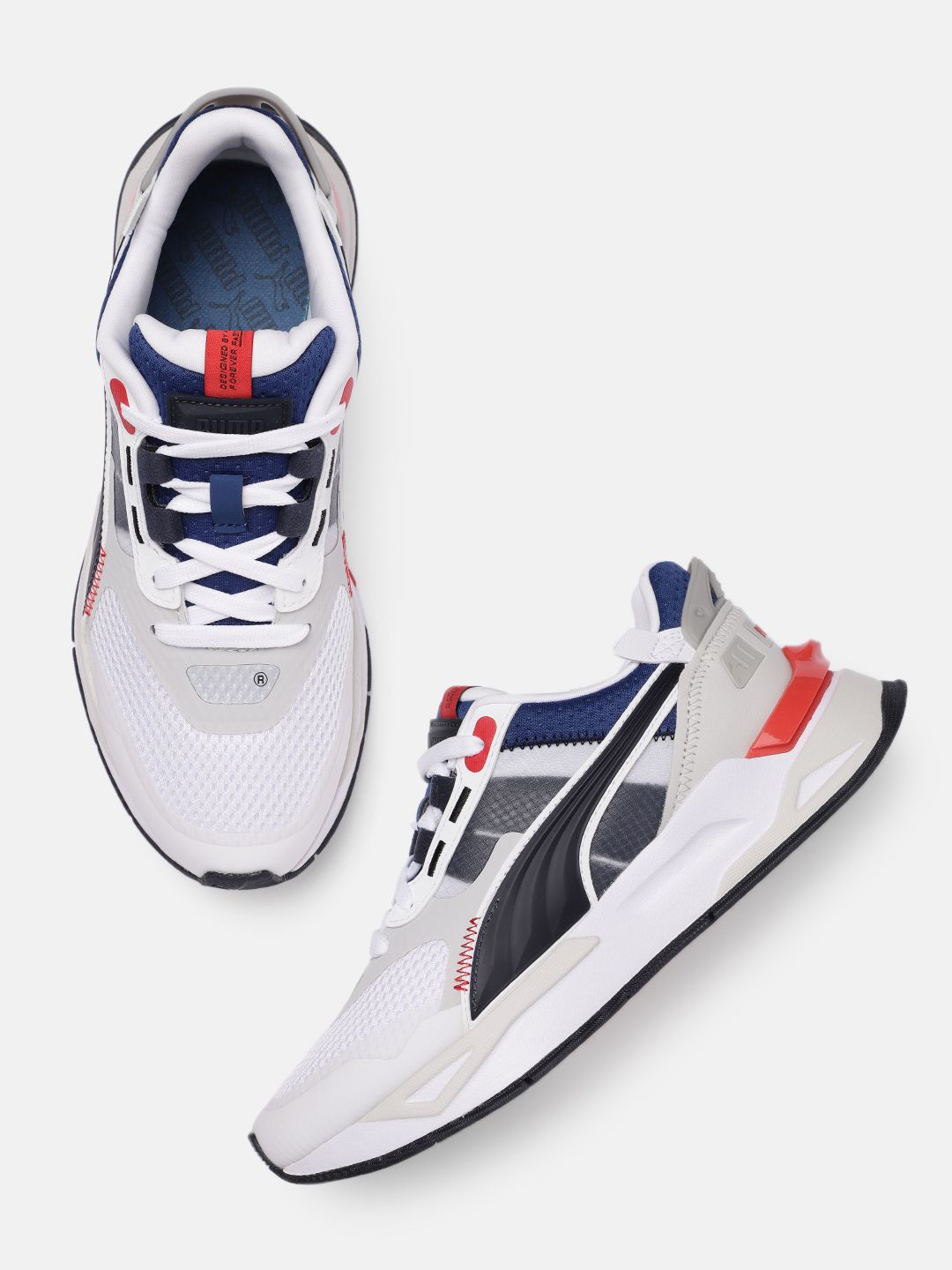 Puma Unisex White Solid Sneakers Price in India