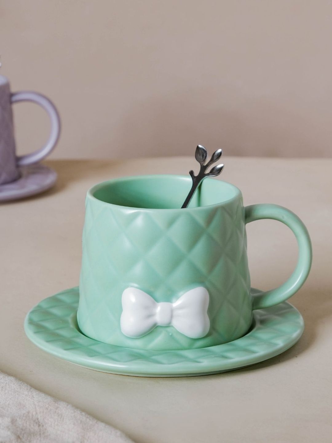 Nestasia Green Textured Bow Ceramic Cup With Saucer & Spoon Price in India