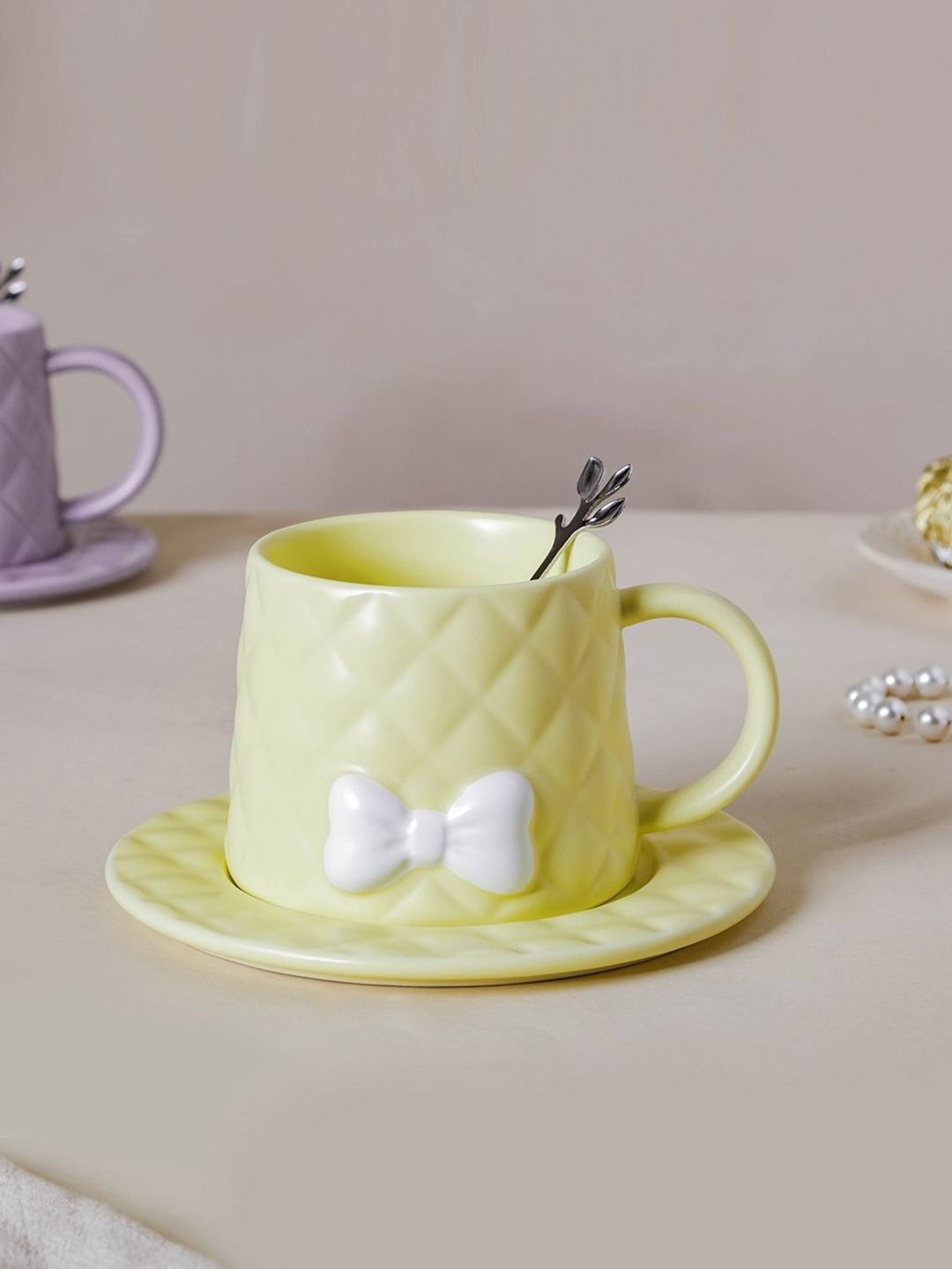 Nestasia Yellow Textured Bow Ceramic Cup With Saucer & Spoon Price in India