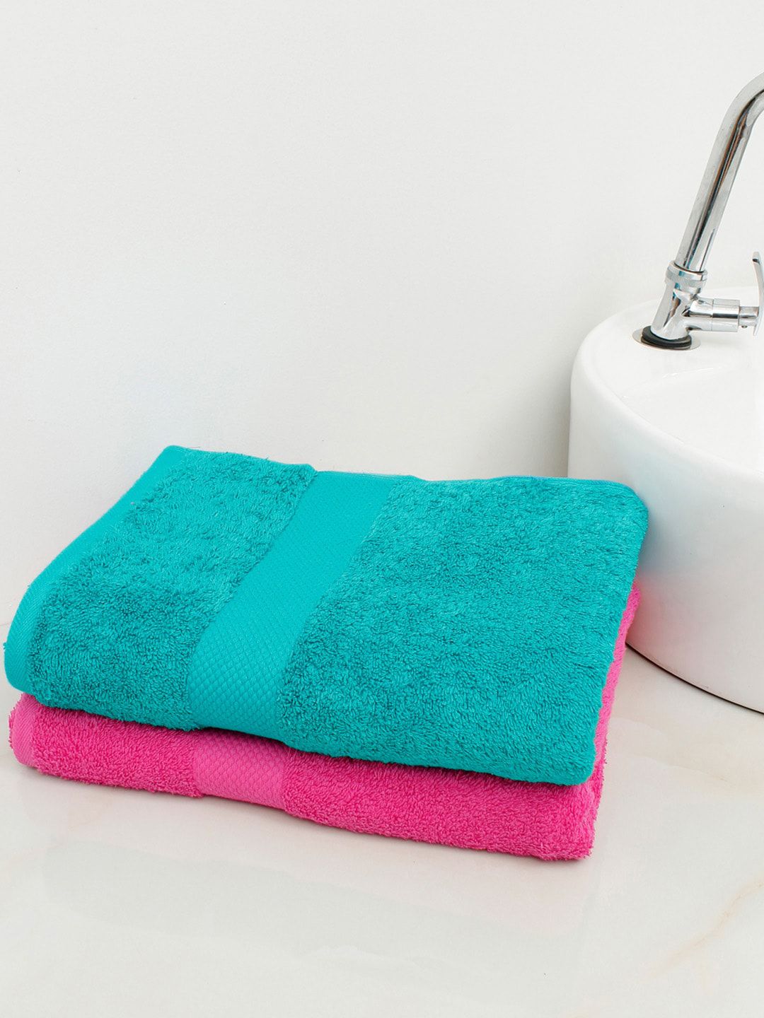 AVI Living Set Of 2 Pink & Blue Solid 500 GSM Cotton Bath Towels Price in India