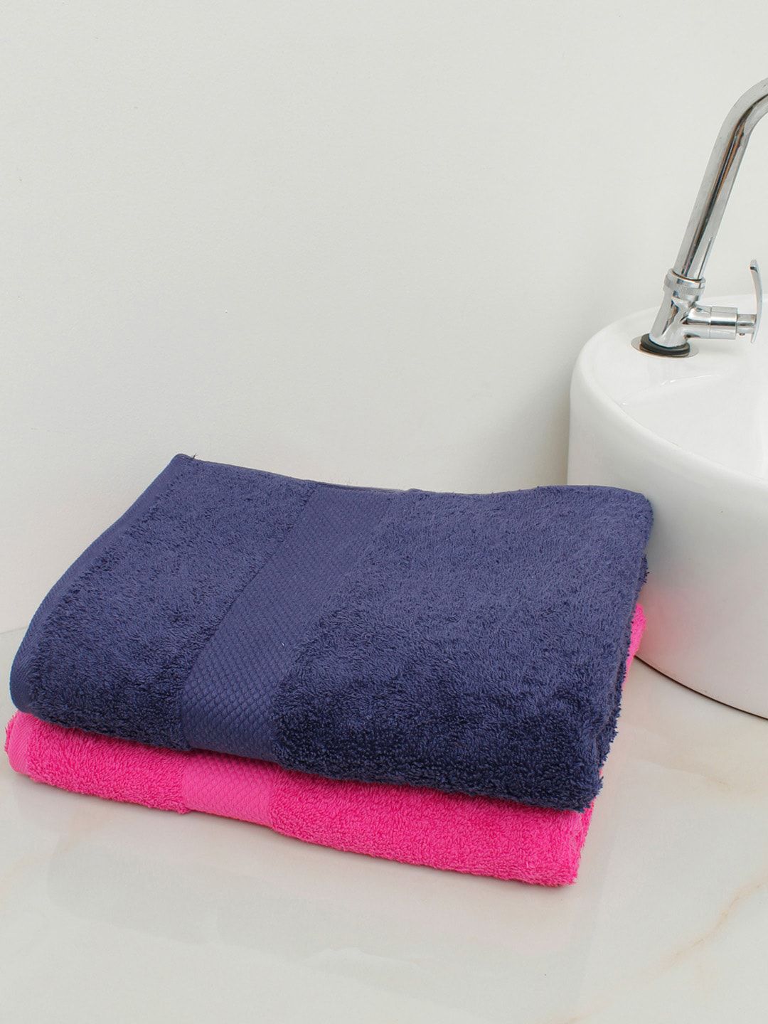 AVI Living Set Of 2 Pink & Navy Blue Solid 500 GSM Cotton Bath Towels Price in India