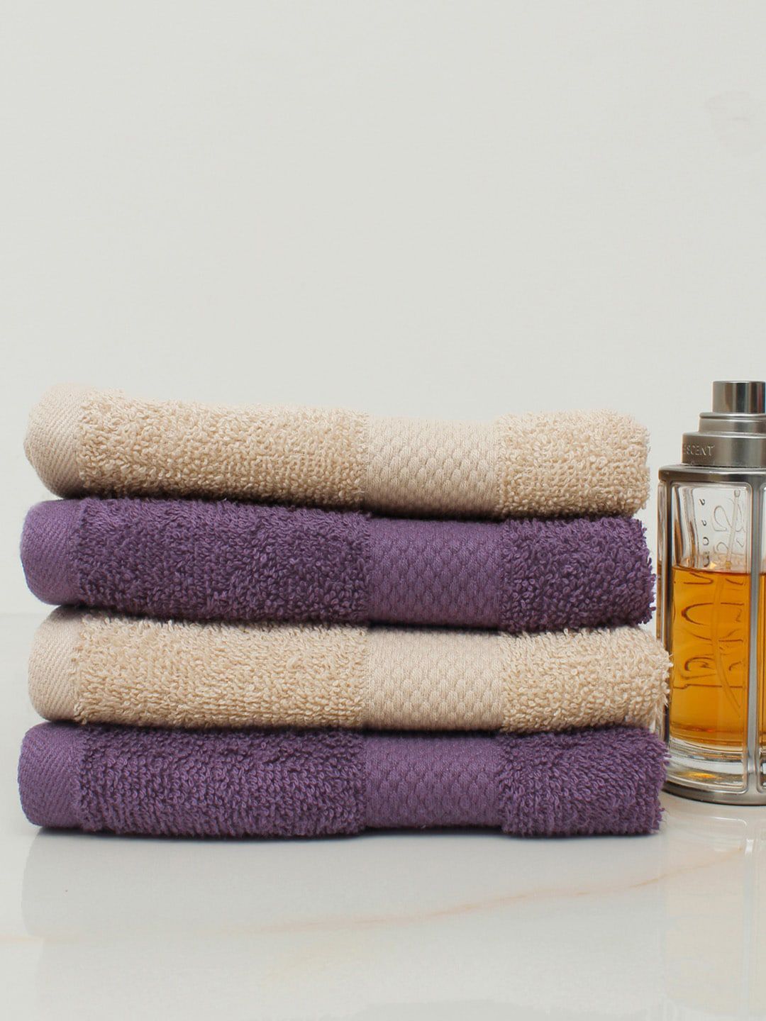 AVI Living Set Of 4 Beige & Purple Solid 500 GSM Hand Towels Price in India