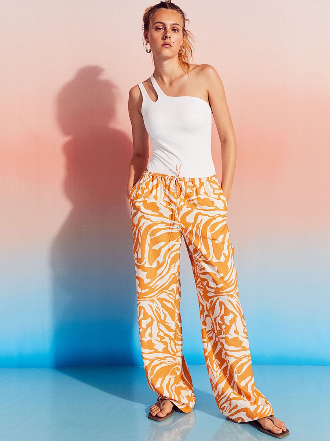 H&M Women Orange Floral Printed Straight Fit High-Rise Trousers Price in India