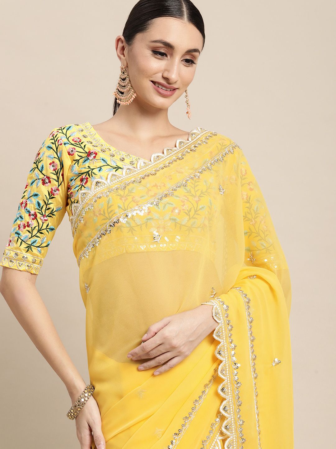 VAIRAGEE Yellow Floral Embroidered Saree Price in India