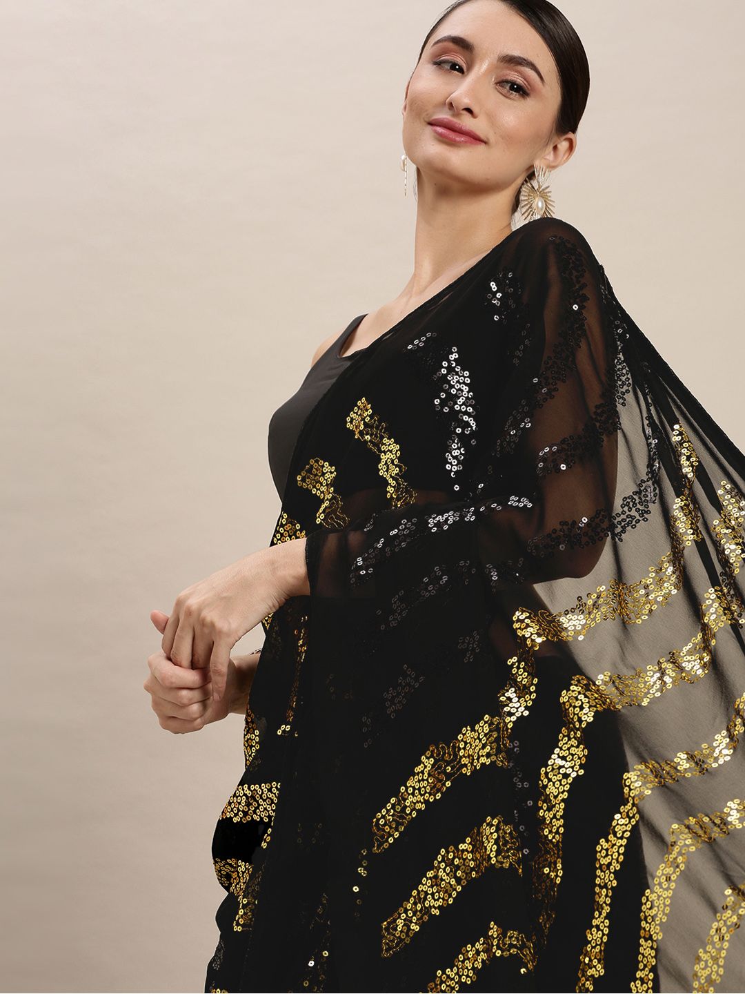 VASTRANAND Yellow & Black Embellished Sequinned Saree Price in India