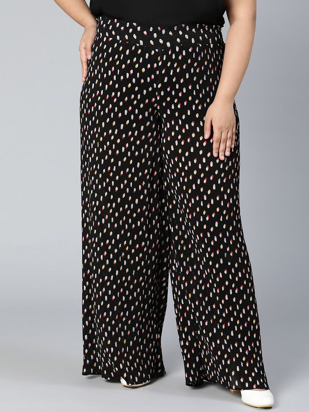 Oxolloxo Women Black Printed Trousers Price in India