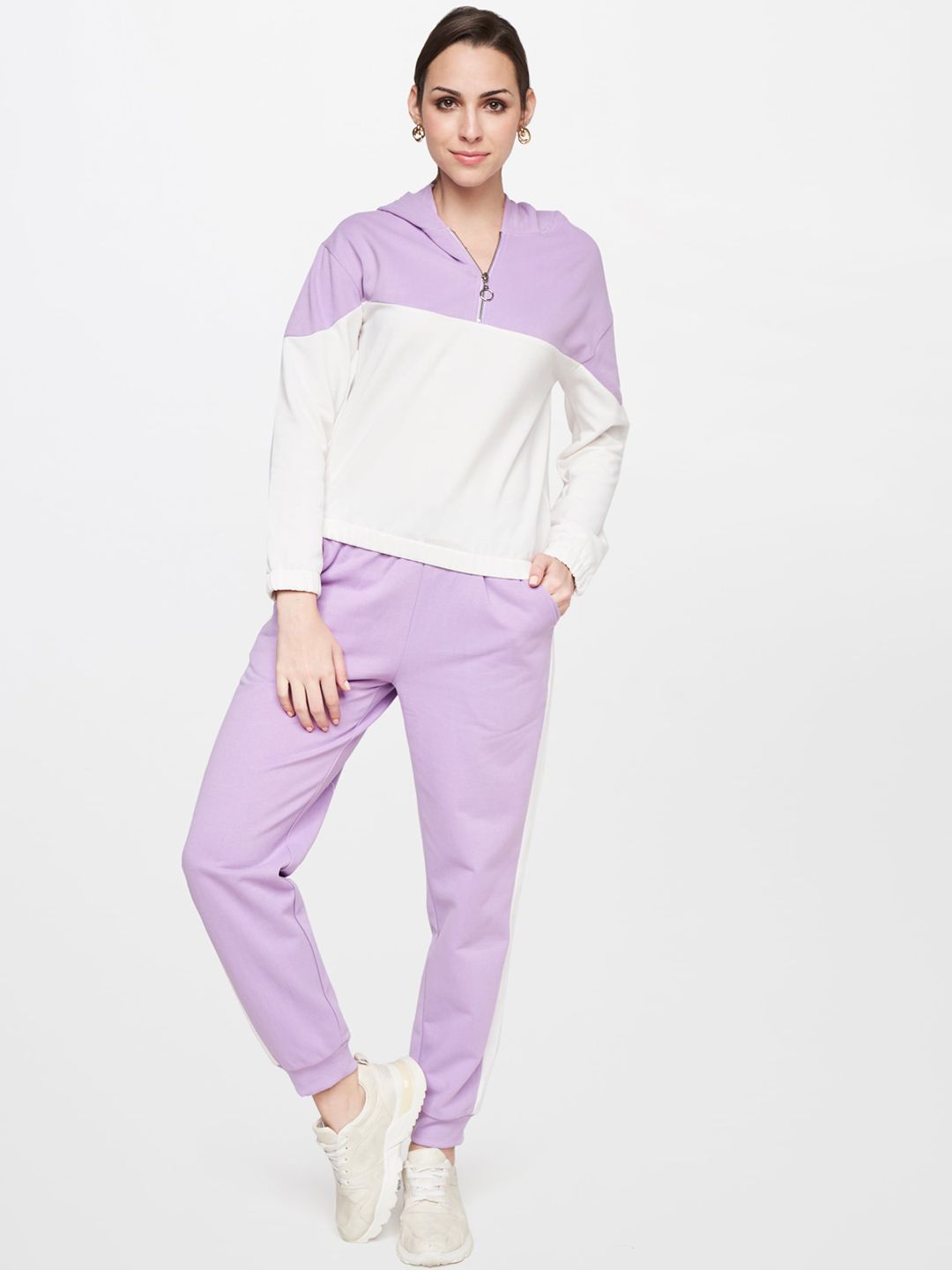 AND Women Lavender & White Colourblocked Tracksuit Price in India