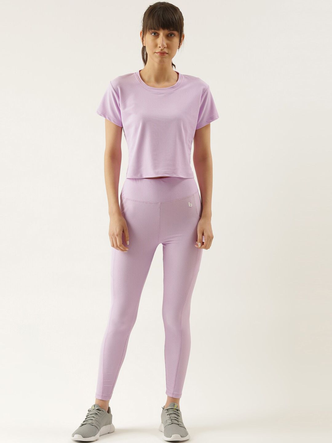 Bannos Swagger Women Lavender Solid Tracksuit Price in India