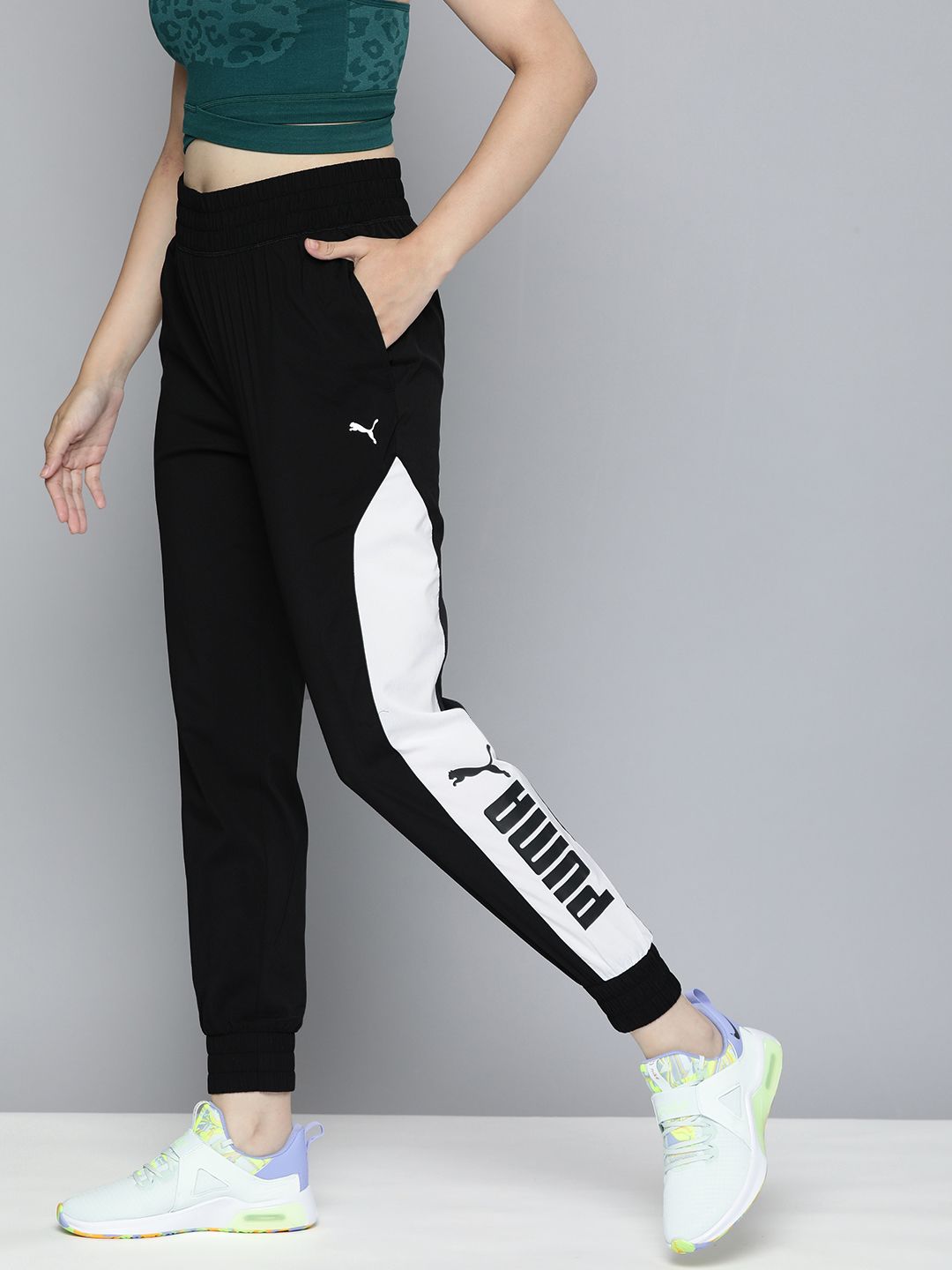Puma Women Black Relaxed Fit Woven dryCell Brand Logo Print Joggers Price in India
