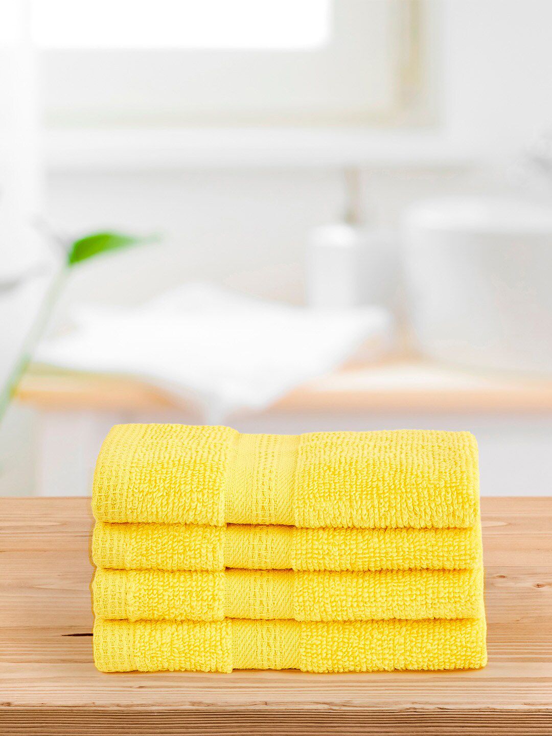Layers Yellow Set of 4 400 GSM Zero Twist Face Towels Price in India