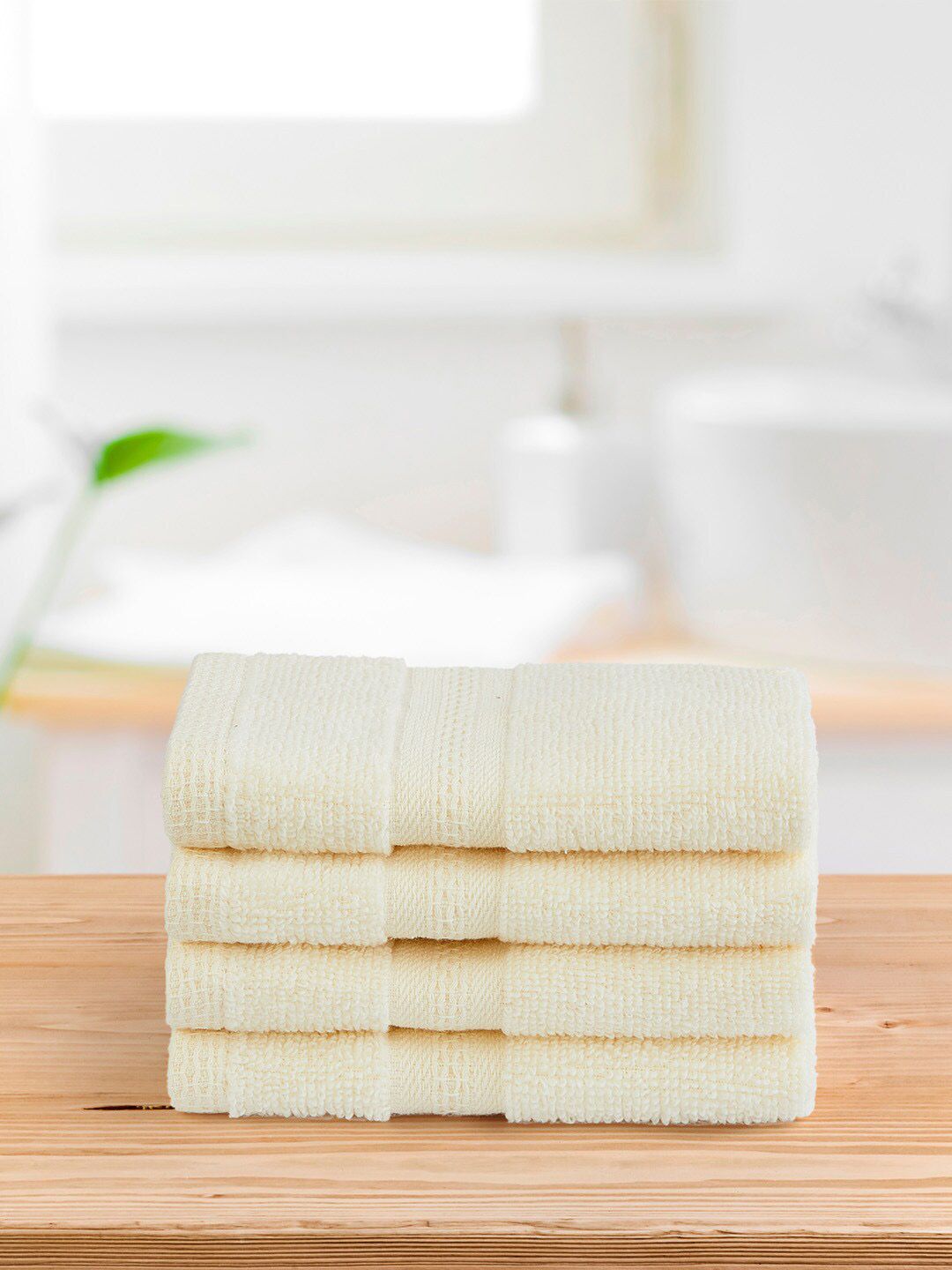 Layers Pack of 4 Off White Solid 400 GSM Cotton Face Towels Price in India