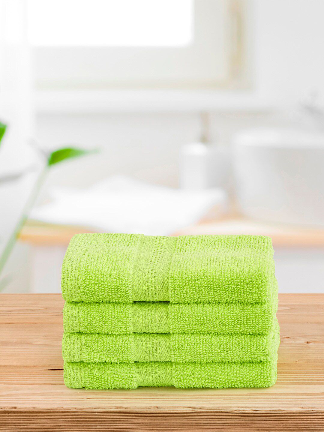 Layers Set of 4 Lime Green Solid Pure Cotton 400 GSM Face Towels Price in India