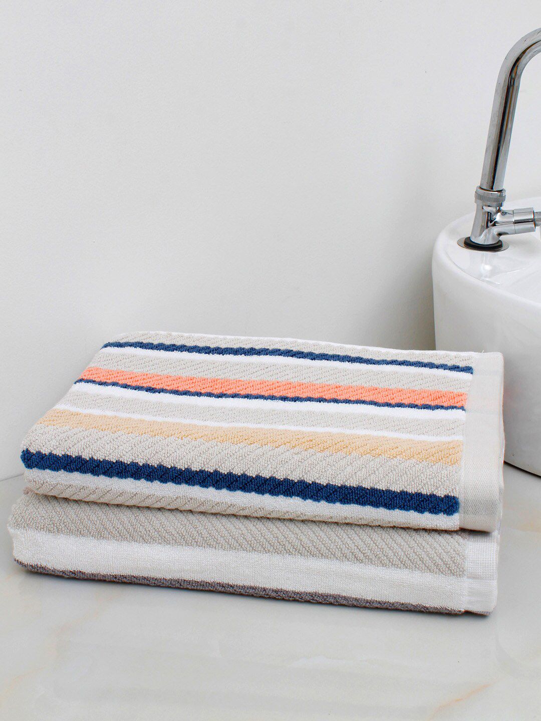 AVI Living Pack Of 2 Coral & Beige Striped 600 GSM Pure Cotton Bath Towels Price in India