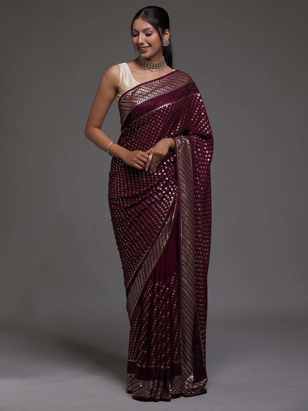 Koskii Maroon Embellished Sequinned Saree Price in India