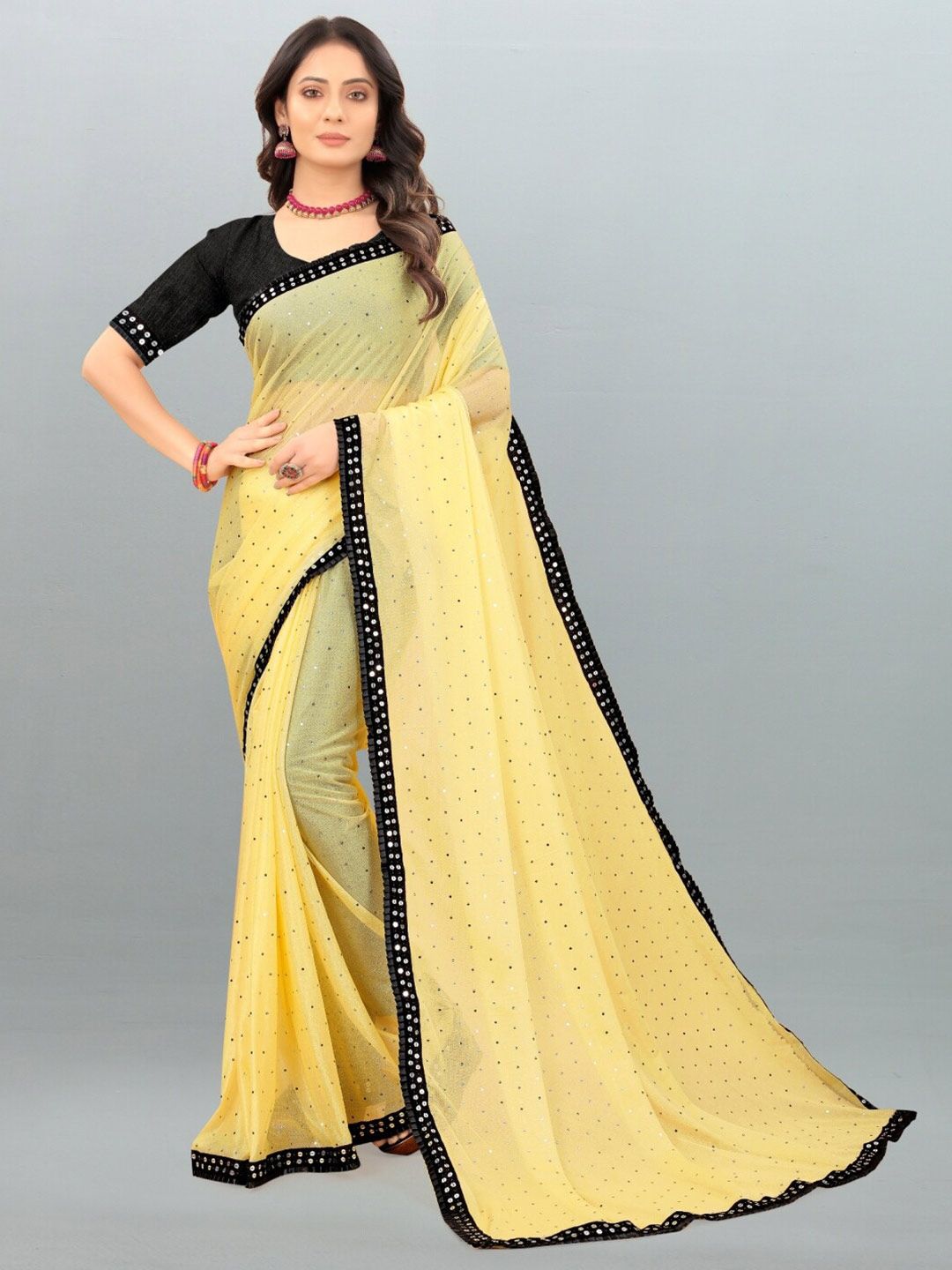 APNISHA Yellow & Black Embellished Saree Price in India