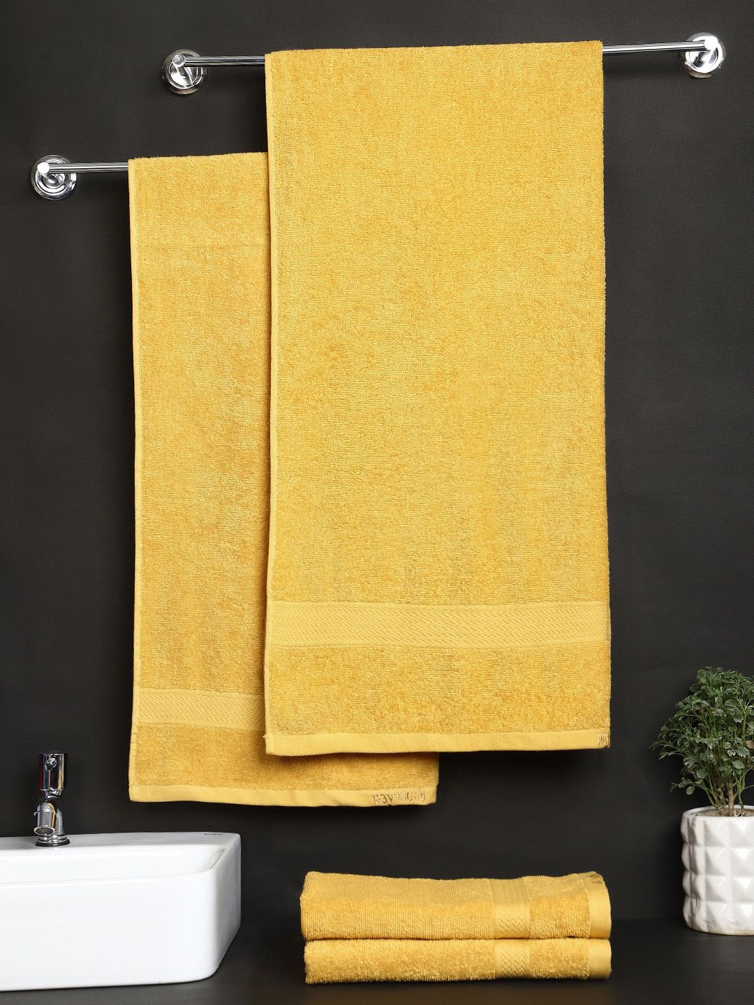 Raymond Home Set Of 4 Yellow Solid 380 GSM Pure Cotton Bath & Hand Towel Price in India