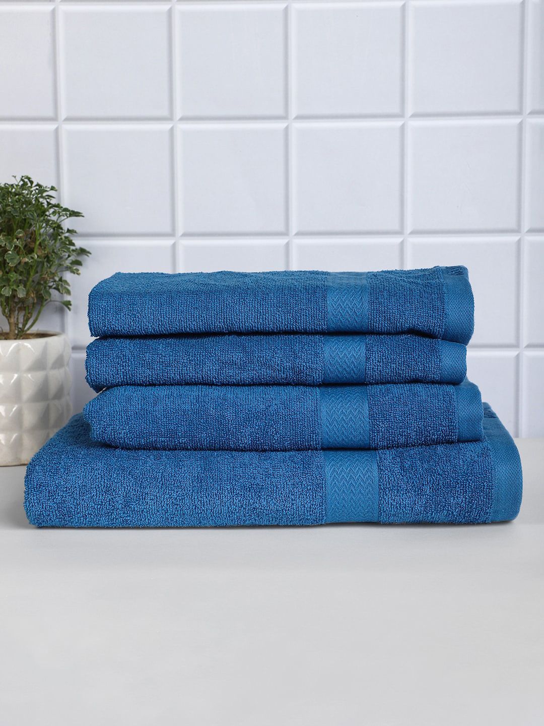 Raymond Home Set Of 4 Blue Solid 380 GSM Pure Cotton Bath & Hand Towel Set Price in India