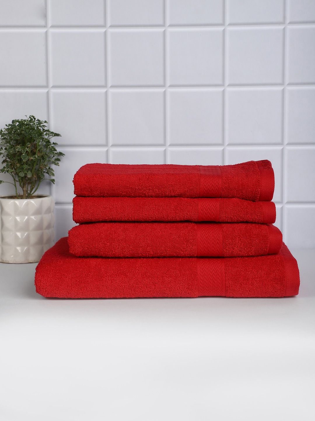 Raymond Home Set Of 4 Red Solid 380 GSM Pure Cotton Bath & Hand Towel Price in India