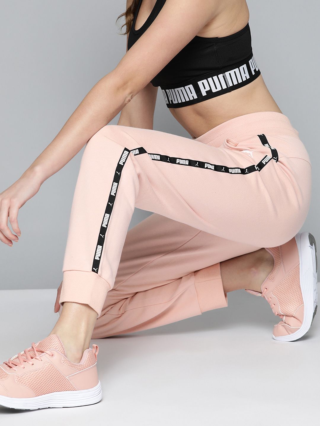 Puma Women Pink Power Tape Solid Joggers With Printed Side Stripes Price in India