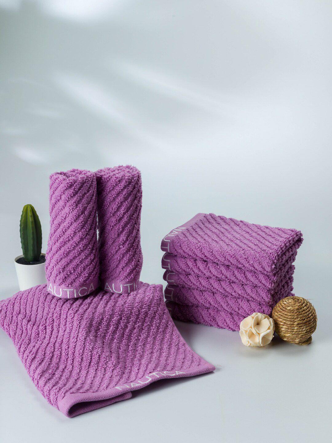 Nautica Set Of 8 Purple Solid 600 GSM Fluffy Zero Twist 100% Cotton Face Towels Price in India