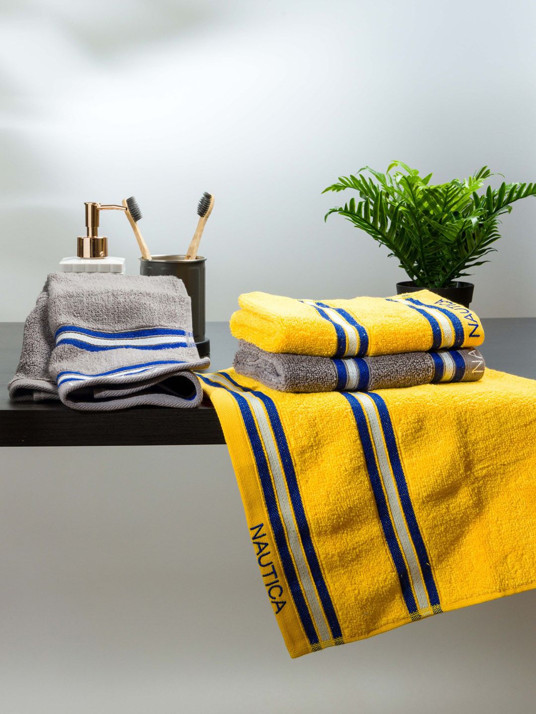 Nautica Yellow And Grey Solid Cotton Hand Towels Price in India