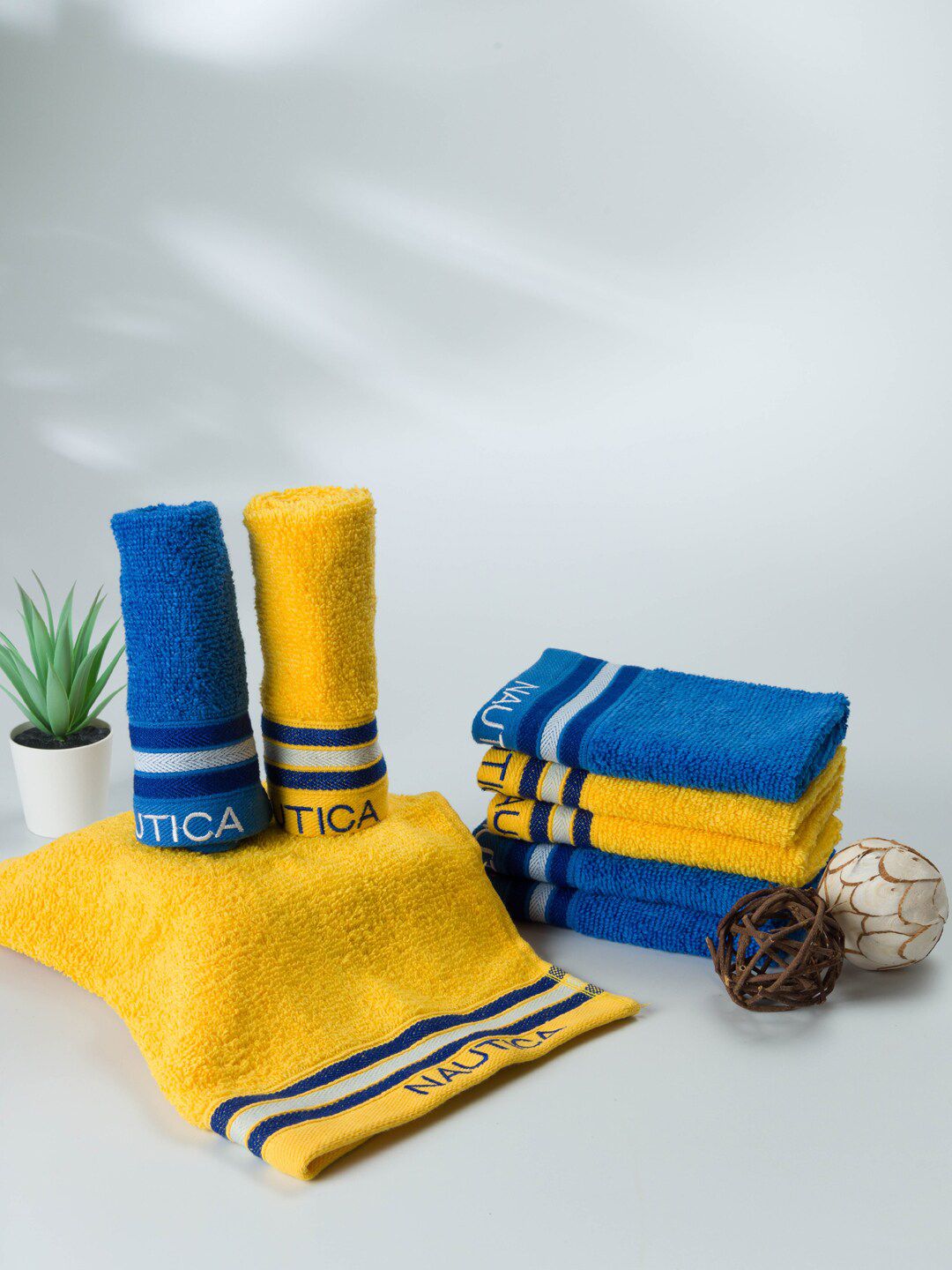 Nautica Set Of 8 Yellow & Blue 500 GSM Solid Cotton Face Towels Price in India